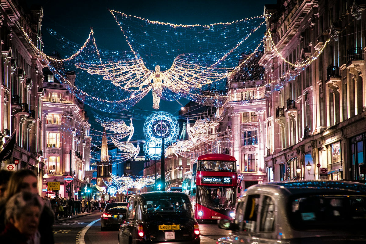 Regent Street in London decorated with illuminated Christmas angels at dusk