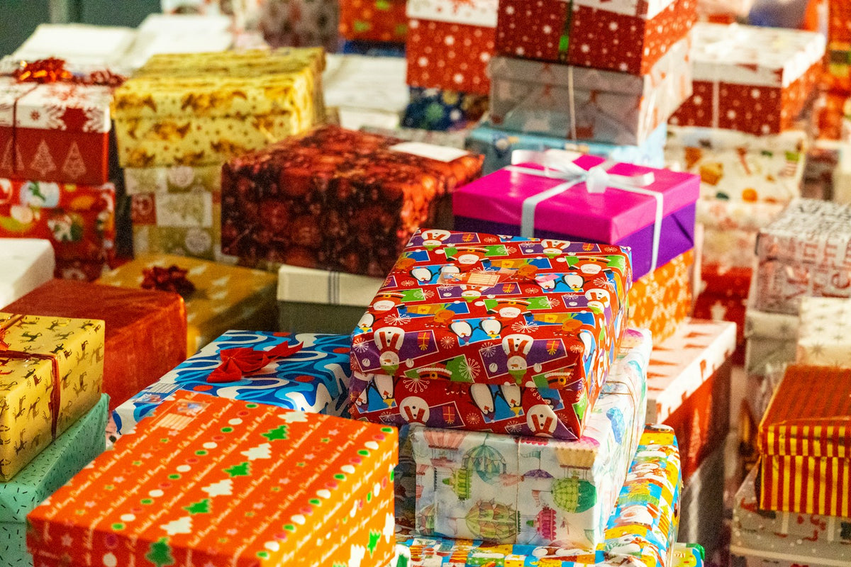 Colorful pile of wrapped Christmas presents ready for a White Elephant gift swap