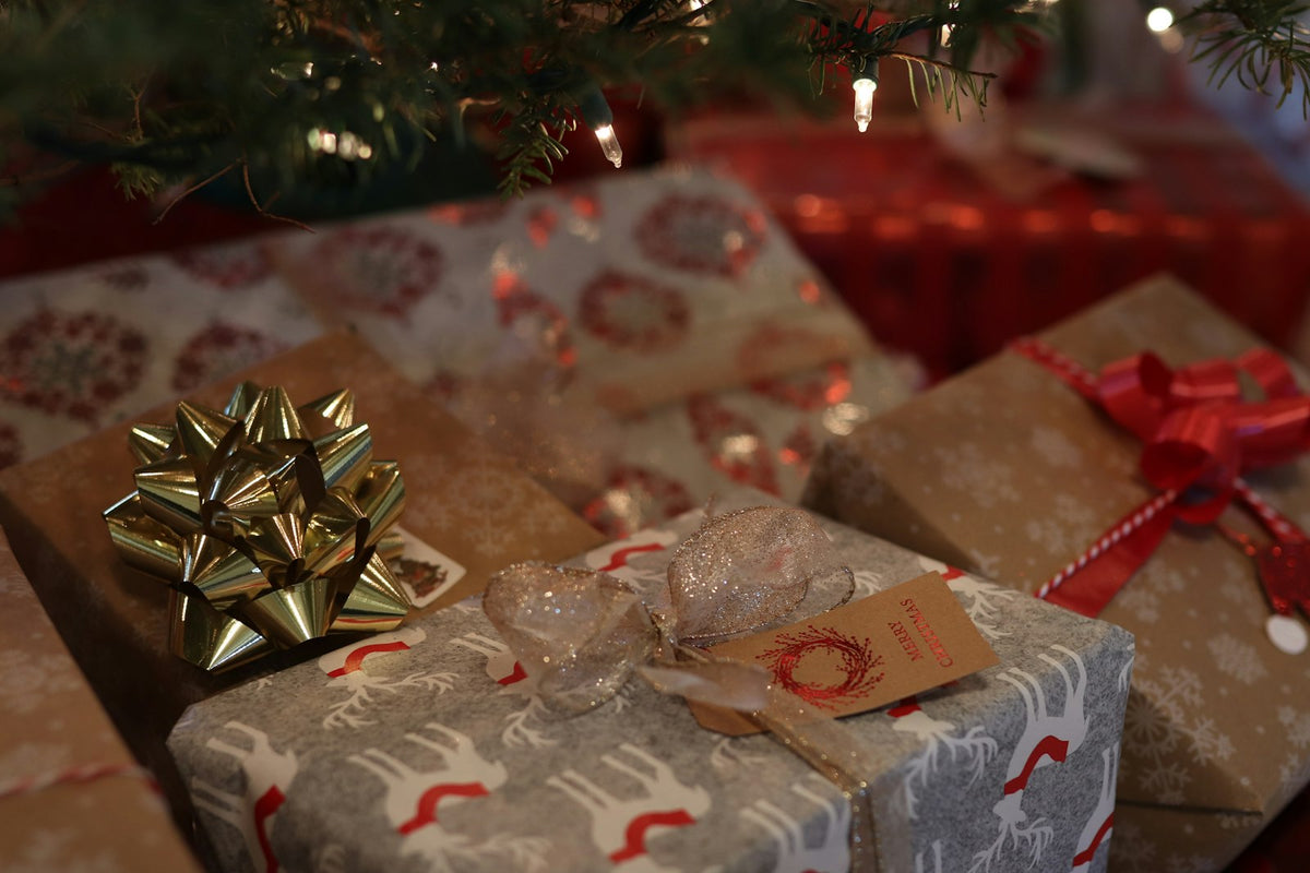 Christmas gifts wrapped in kraft paper under the tree